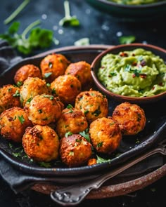 some food is sitting on a plate with guacamole