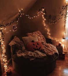 a room with lights and decorations on the walls, including a round bean bag chair