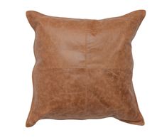 a brown leather pillow on a white background