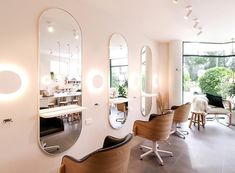 the salon is clean and ready for customers to take their own pictures in it's mirrors