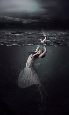 a woman is floating in the water with her arms out and head above the water