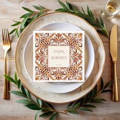 a place setting with gold and white plates