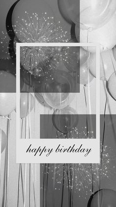 a black and white photo with balloons, streamers and a happy birthday sign in the middle