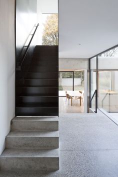 the stairs in this modern house are made of concrete