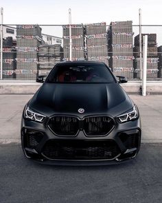 the front end of a black bmw car