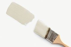 a paint brush with white bristles on it