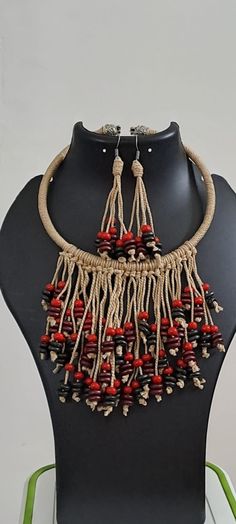 This is an exclusive neckband wrapped with beige thread and fringes with multi coloured wooden beads in centre is adding to the beauty of the neckband. It is correctly said that handmade jewellery has a distinct flavour to it which is why thread jewellery is very popular. Thread jewellery is colourful, light in weight and looks smashing with ethnic as well as western outfits too. Jute Jewellery Handmade, Jute Jewellery, Wooden Bead Jewelry, Diy Jewellery Designs, Thread Jewellery, Handmade Jewelry Tutorials, Handmade Jewelry Diy, Wedding Jewellery Necklace