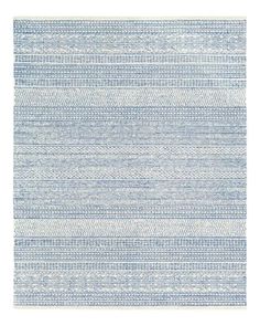 a blue and white rug with vertical stripes on it, in the shape of a rectangle