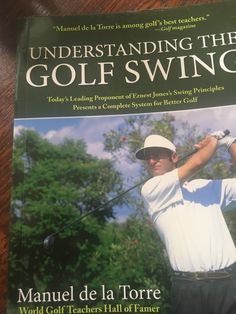 a book on the cover of a man swinging a golf club with trees in the background