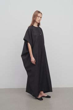 Full-length kaftan dress in midweight wool silk with mid-length kimono sleeves, crew neckline, and hidden front placket with horn button closures.