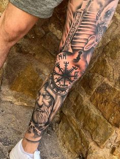 a man with a clock tattoo on his leg