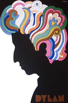 a poster with a woman's head and multicolored hair on the wall