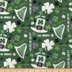 a green and white pattern with shamrocks, hats, and irish symbols on it