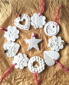 christmas ornaments are arranged in the shape of hearts, stars and other decorations on a sheet of paper