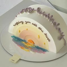 a birthday cake with the words happy birthday written on it