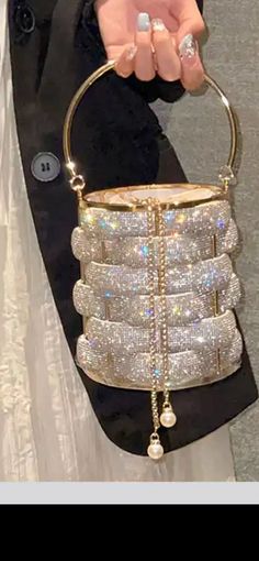 This stunning Crystal Bucket bag has now dropped! This bag would look perfect with any occasion, especially a bridesmaid outfit!  Order will take between 3-5 weeks this is dependent on demand and manufacturing the bag. However, due to off season it has been taking less than 2 weeks for customers to receive their orders. Luxury Bucket Bags For Party, Luxury Rectangular Bucket Bag For Party, Gold Bucket Bag With Detachable Handle For Evening, Elegant Bucket Bag For Party, Gold Pouch-shaped Bucket Bag For Evening, Elegant Gold Bucket Bag With Detachable Handle, Gold Rectangular Bucket Bag For Evening, Luxury Bucket Bag For Party, Luxury Silver Bucket Bag For Party