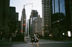 a city street filled with lots of tall buildings