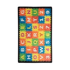 a children's rug with letters and numbers in multi - colored blocks on it