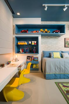 a child's bedroom with toy cars on the shelves