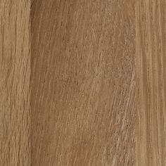 a close up view of the wood grains on a wooden surface, with light brown tones