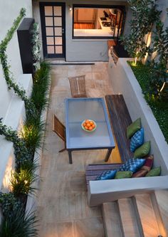 an image of a patio with furniture and plants