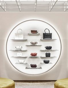 the display case is filled with purses and handbags