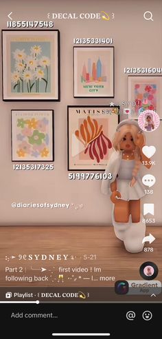 an animated doll sitting on top of a wooden floor in front of some art work