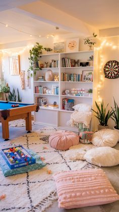 a living room filled with lots of furniture and decor on top of a white rug