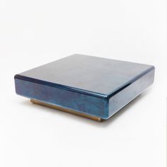 a blue box sitting on top of a white surface