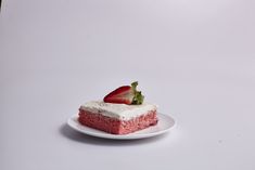 a piece of strawberry cake on a white plate