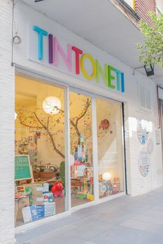 a store front with the word tintonett written on it's glass windows