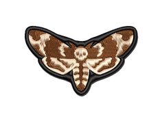 a brown and white moth embroidered on a white background