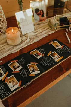 a table with pictures and candles on it