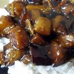 a close up of food on a plate with rice