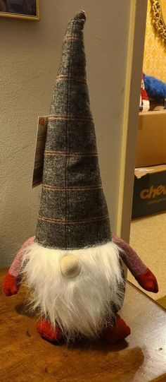 a gnome hat sitting on top of a wooden table