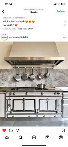 an image of a kitchen with stainless steel appliances on the counter and in front of it are pots and pans