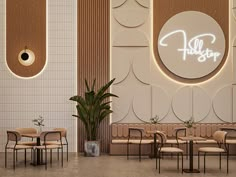 the interior of a restaurant with chairs, tables and plants in front of a wall