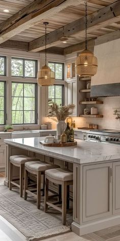 a large kitchen with an island and lots of counter space