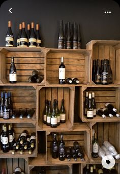 several wooden crates filled with bottles of wine