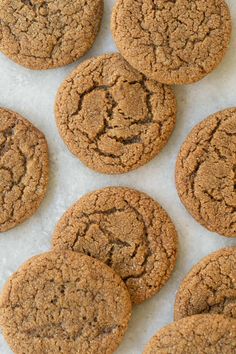 several cookies are arranged on a white surface