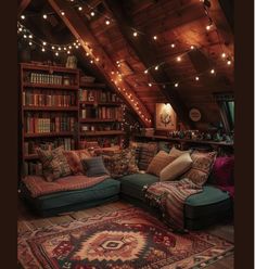 a living room filled with lots of furniture and bookshelves covered in string lights