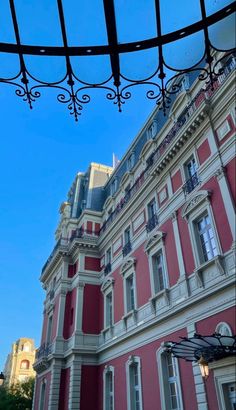 an old building with red and white stripes on it