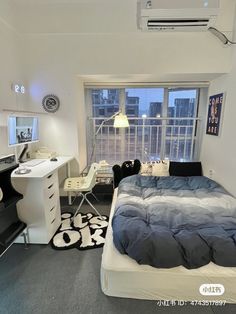 a bed room with a neatly made bed and a desk