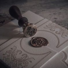 a wax stamp on top of some white paper