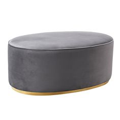 a grey ottoman with gold trim