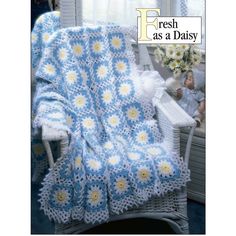 a crocheted blanket with daisies on it and the words fresh as a daisy