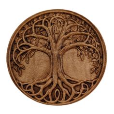 a carved wooden plaque with a tree on it