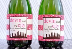 two bottles of wine with pink and brown designs on the top one is labeled devilin and the city