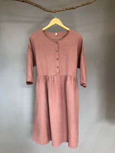 "Made from medium weight linen, this dress is very soft and swings comfortably, allowing movement in all the right places. Buttoned front and loose fit design, it will be a staple in your wardrobe for a long time to come. -100% linen construction -Below the knee length (or to be customized per request) -3/4 sleeves ( or to be customized per request) -Half front closure with buttons -Gathered waist -Two side pockets - Listing Colors: Grayish Blue, Blush, Amber, Teal Please provide your shoulder w Fall Midi Dress, Midi Linen Dress, Linen Camisole, Linen Slip Dress, Midi Dress Fall, Linen Fashion, Cotton Slip, Linen Midi Dress, Dress Linen