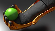 an orange and green object on top of a black arm